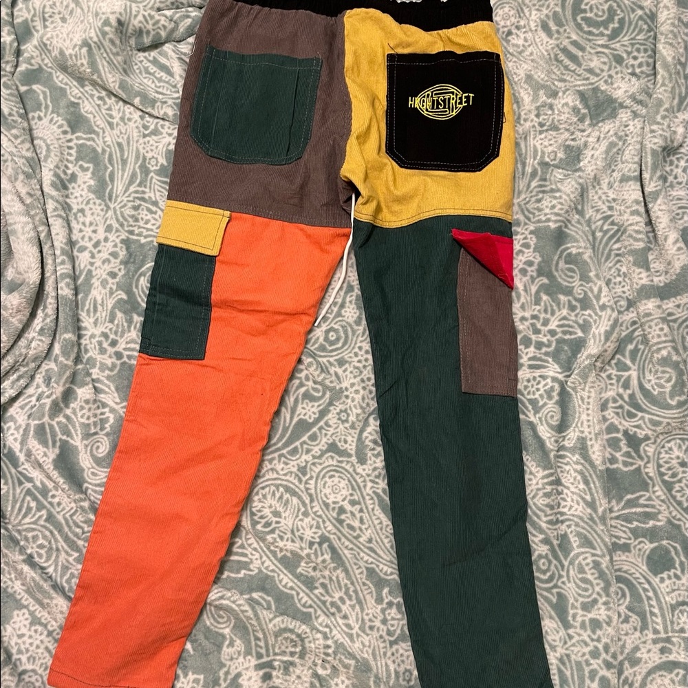 Multi color cargo pants with elastic around the waste. A size small.